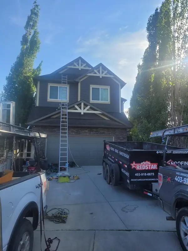 Red Star Renovations crew and trailer on a Calgary job