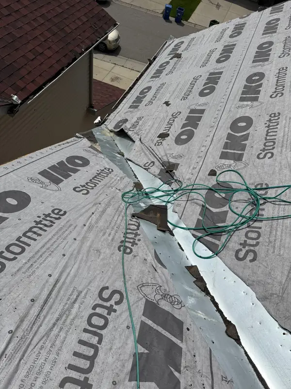 Metal valley flashing over ice and water shield