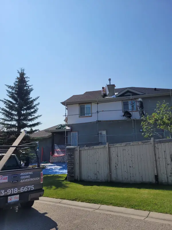 Stucco repair on a two-storey home